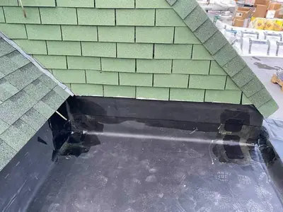 Shingle and rubber flashing detail work